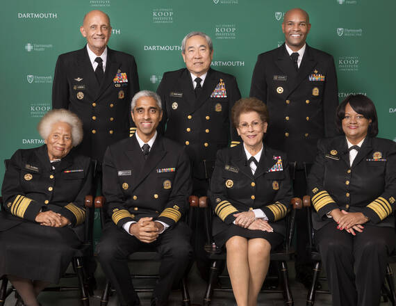 Front row, from left: Joycelyn Elders, 1993-1994, Vivek Murthy, 2014-2017 and 2021-present, Antonia Coello Novello, 1990-1993, Regina Benjamin, 2009-2014.  Back row, from left: Richard Carmona, 2002-2006, Kenneth Moritsugu, 2002-2002, 2006-2007, and Jerome Adams, 2017-2021.  David Satcher, 1998-2002, was unable to attend in person, but shared comments on mental health via a video statement, rounding out the panel to include all of the living U.S. Surgeons General.