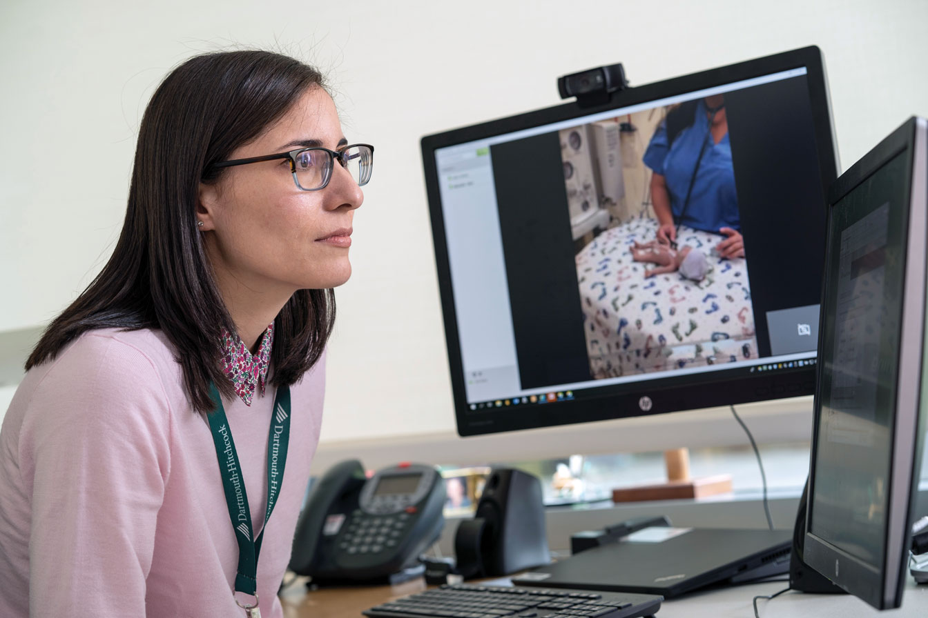 Michelle Tyler, MD, neonatologist, trains local providers in the use of telehealth technology through practice calls.