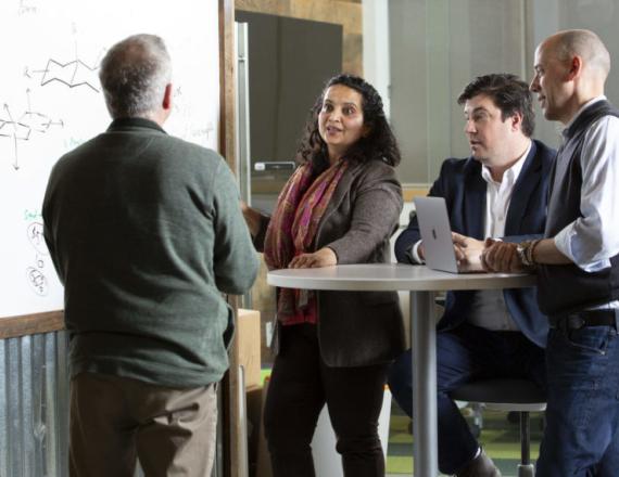 In early 2020, Gaur and Dartmouth chemist Glenn Micalizio, PhD, (far right) met with Barry Schweitzer, PhD, D’82 (far left) of the Technology Transfer Office and Jamie Coughlin (second from right) of the Magnuson Center for Entrepreneurship to discuss a promising new therapy for brain cancers.