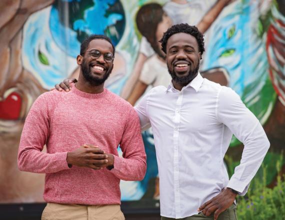 Kenny Williams ’21 (left) and Shuaibu "Sha" Ali ’21 (right) mentor students at Vermont's Hartford High School. Photo by Kata Sasvari