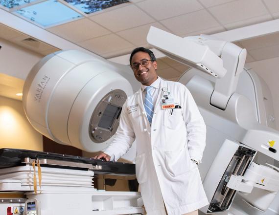 Behind Nirav Kapadia, MD, is a linear accelerator, a state-of-the-art machine that gives radiation oncologists in St. Johnsbury the ability to treat patients with the most advanced techniques available. Photo by Kata Sasvari