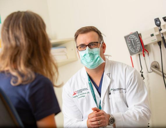 Cardiovascular medicine specialist Gregory Dadekian, MD, speaks to a patient.