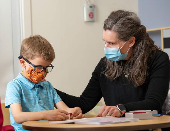 A child plays with developmental and behavioral pediatrician Nina Sand-Loud, MD.