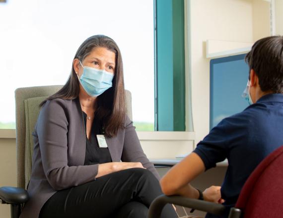 A Dartmouth-Hitchcock psychiatrist talks with a child.