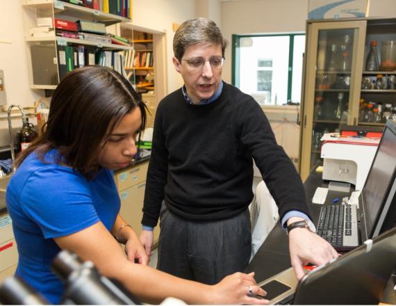 Immunology Program Director and Professor of Microbiology and Immunology Charles Sentman, PhD in a teaching moment with Tiffany Coupet, PhD (Guarini ’20) pre-COVID protocols. 