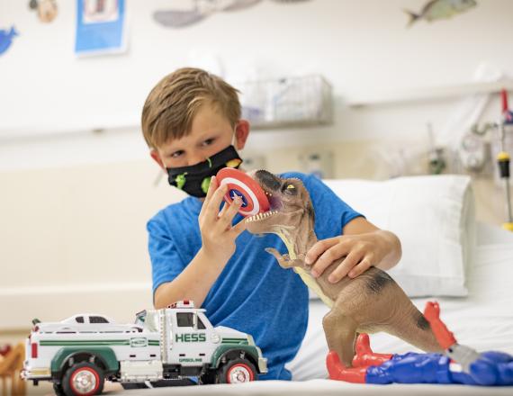 A little boy playing with toys