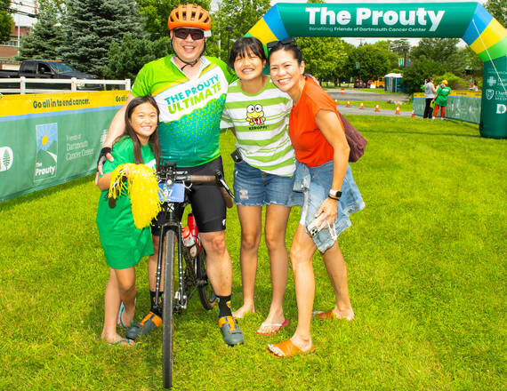 Prouty participant at finish line with family