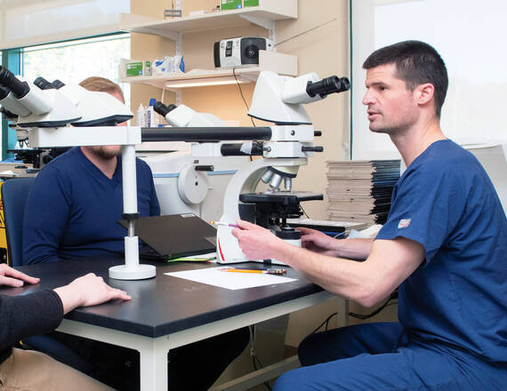 Matt LeBoeuf, MD, PhD, section chief and director of Mohs Micrographic Surgery (right), is investigating how artificial intelligence (AI) and machine learning could help surgeons make the most precise excisions possible in real time.