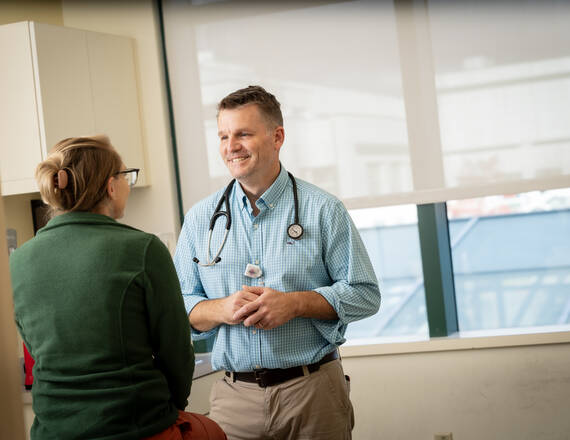 DHMC gastroenterologist Timothy Gardner, MD, with a patient