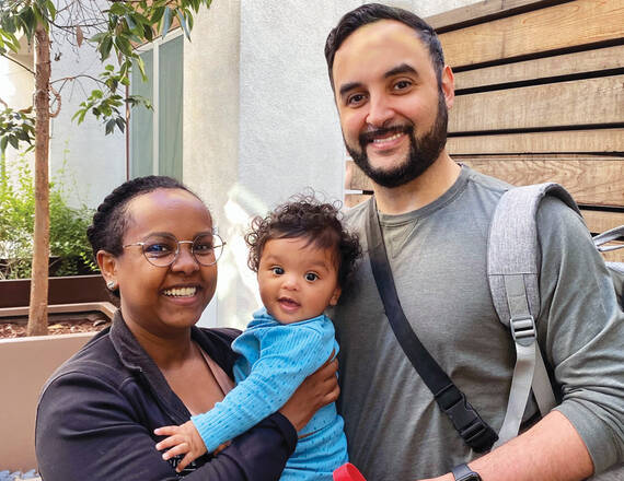 Geisel alum Joe Graterol, MD, MED '15 (right), with his wife, Sara Kibrom, MD, MED '15, and their son, Noah.