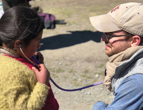 adult doctor, young child and stethoscope