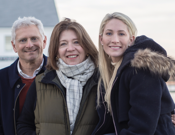 Alexandra “Alex” Manfull (right) with her parents.  Photo courtesy of the Manfull family